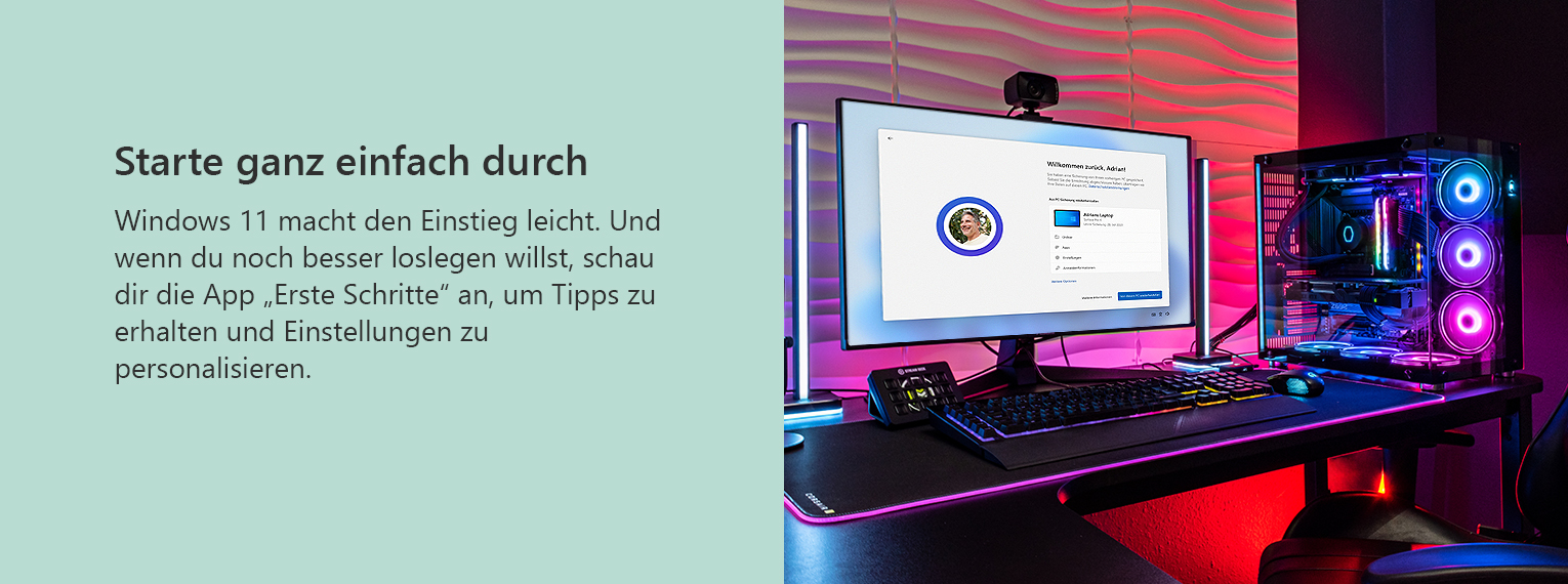 PC mit RGB-Beleuchtung auf einem beleuchteten Gaming Setup und auf dem Bildschirm wird Windows 11 eingerichtet